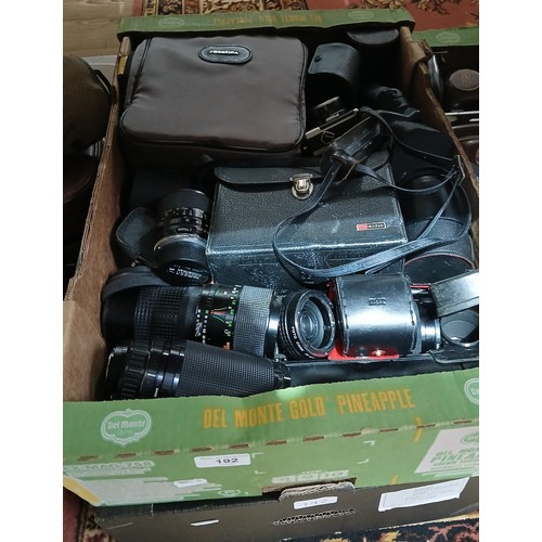 192 - Two boxes of assorted cameras and accessories.