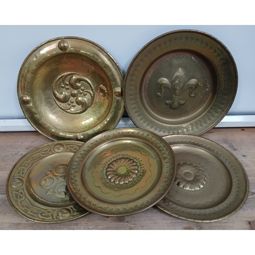 228 - A group of five Arts & Crafts brass alms dishes, diameter approximately 35cm each.