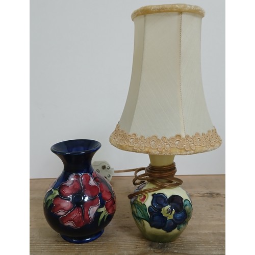 263 - A Moorcroft pottery vase, height 14cm and a Moorcroft table tamp.