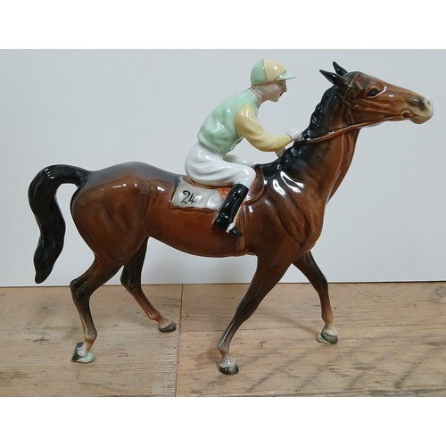 289 - A Beswick race horse and jockey 'Walking Race Horse', no. 1037, length 26cm.