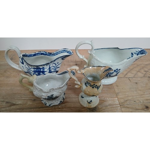 310 - A group of three English porcelain sauce boats and one cream ware.