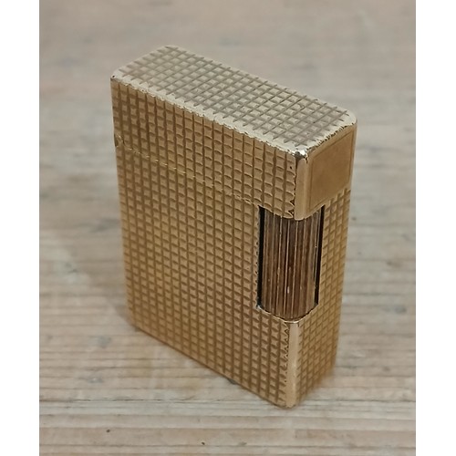 384 - A vintage Dupont gold plated lighter.