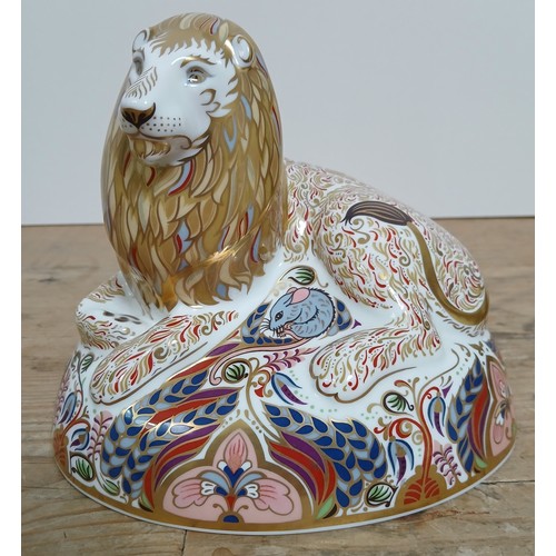 287 - A royal Crown Derby porcelain Lion paperweight modelled as a recumbent lion, gold stopper.