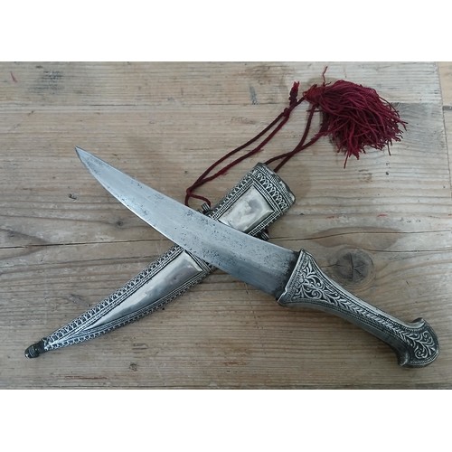 377 - An eastern white metal mounted dagger, length 30cm.