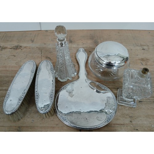 395 - A hallmarked silver dressing table set.