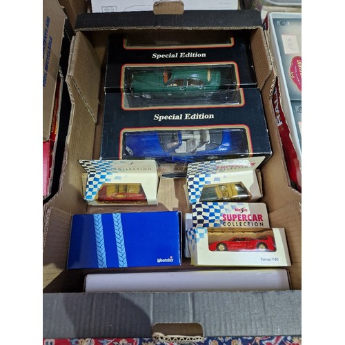 477 - A box of assorted boxed die-cast model vehicles.