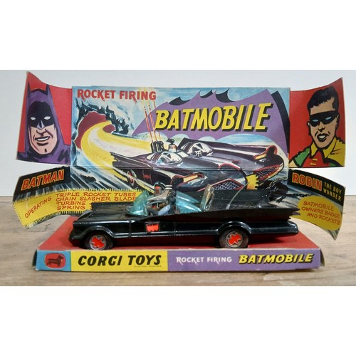 465 - A Corgi Toys 'Rocket firing Batmobile', with Batman & Robin figures, 10 rockets, instructions, inner... 