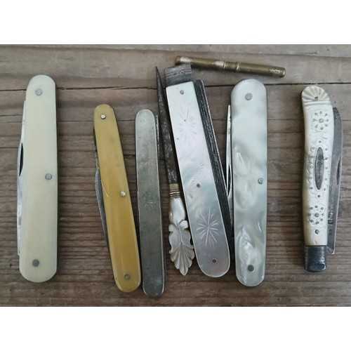 661 - A collection of penknives including hallmarked silver and mother of pearl.