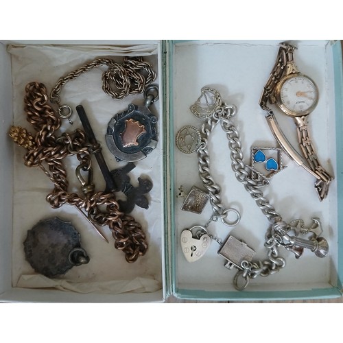 666 - A mixed lot including a hallmarked 9ct gold wristwatch, a silver charm bracelet chains and fobs.