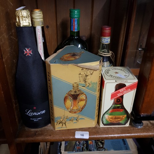 16 - Twelve bottles of alcoholic beverages, including Lanson Black label, Haig Dimple whisky, Martini, Ru... 