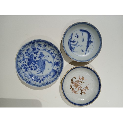 257 - A group of five Chinese porcelain tea bowls and saucers including Ca Mau ship wreck, and two others.