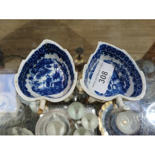 308 - A pair off English 18th century relief moulded blue and white porcelain dishes, of leaf form, the in... 