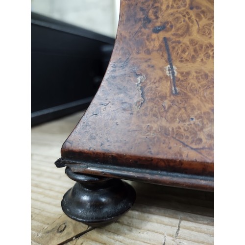 215 - A mid 19th century burr yew wood and rose wood tea caddy of waisted sarcophagus form, with cut glass... 