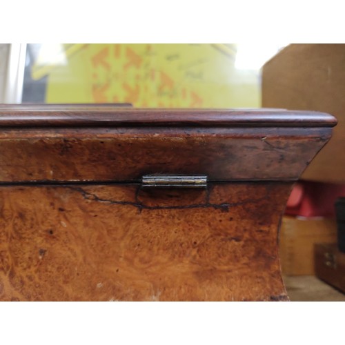 215 - A mid 19th century burr yew wood and rose wood tea caddy of waisted sarcophagus form, with cut glass... 