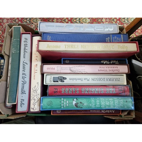 156 - Nine boxes of Folio Society titles, approximately 155 and another box of assorted books.