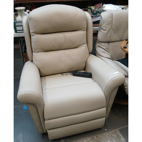 1031 - A cream leather electric reclining armchair.