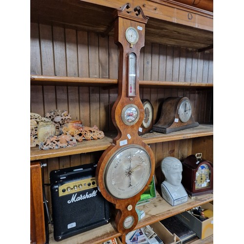 18 - An Oak cased barometer