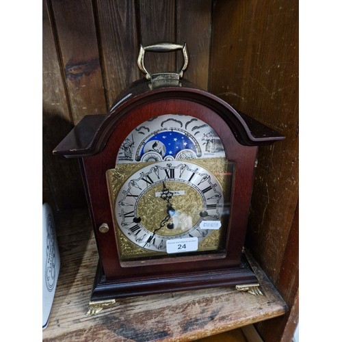 24 - A Hermle mantle clock, 26cm high.