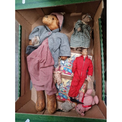 70 - A box of vintage toys including Action Man, teddy bears and dolls.