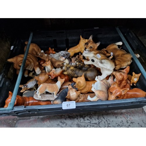 67 - A box of Corgi dog figurines, various makers.