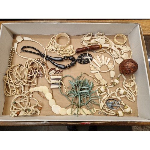 76 - A box of carved items