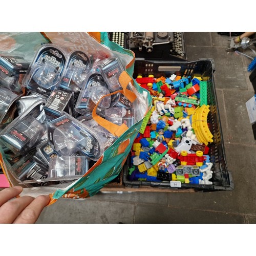 84 - A box of assorted Duplo blocks & a bag of assorted boxed Neca Scalers