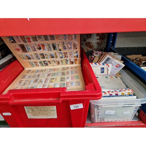 133 - A box of assorted world stamp albums & a box of world covers.