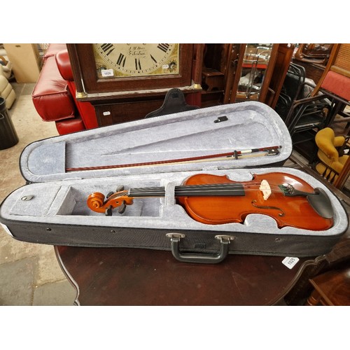 175 - A Riff student violin with bow, in padded case.