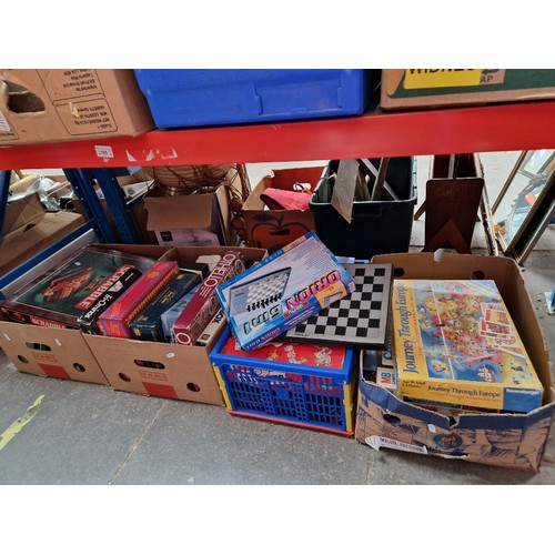 165 - 4 boxes of boxed games including Scrabble, Othello, Trivial Pursuit, Connect 4 etc