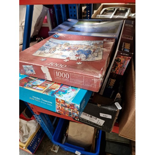 157 - A box of jigsaws, ten in total.