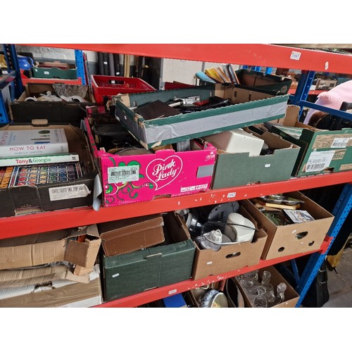 179 - Nine boxes of assorted household items to include mobile phones, bbq & suitcase etc.