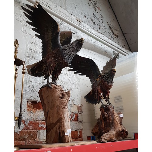 224 - Two eagle sculptures on wooden bases.