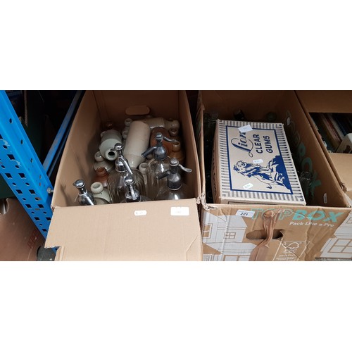 221 - Three boxes of glass bottles, soda syphons, small stoneware jars, Preston inscribed bottles, eye was... 
