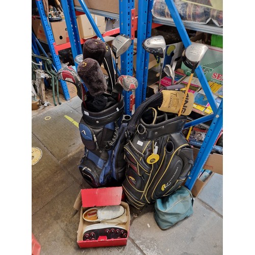 211 - Two golf bags containing a number of clubs, mainly drivers (2 Taylormade & 1 Ping), woods etc togeth... 