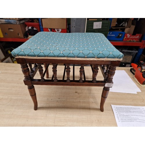 1037 - A Victorian mahogany piano stool.