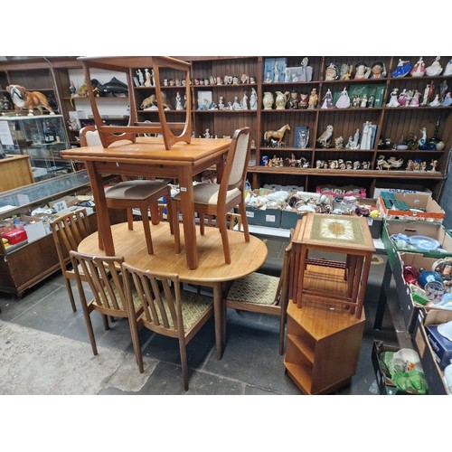 1036 - A mixed lot of mid 20th century teak furniture comprising two tables and chairs, TV stand, tile top ... 