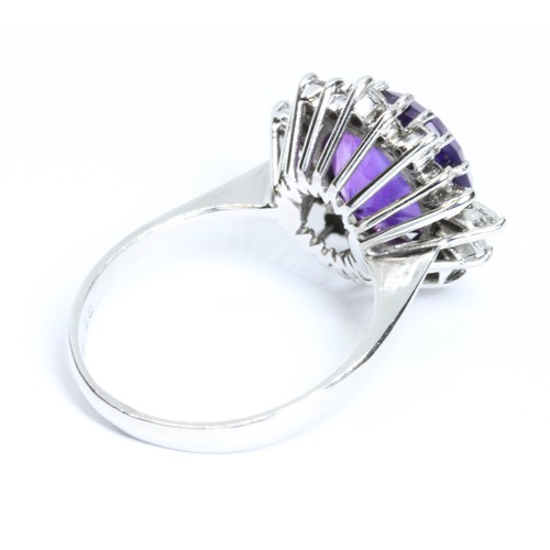 1 - AN 18CT WHITE GOLD AMETHYST AND VARI-CUT DIAMOND CLUSTER RING, the central round mixed cut amethyst ... 