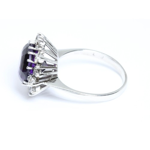 1 - AN 18CT WHITE GOLD AMETHYST AND VARI-CUT DIAMOND CLUSTER RING, the central round mixed cut amethyst ... 