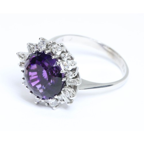 1 - AN 18CT WHITE GOLD AMETHYST AND VARI-CUT DIAMOND CLUSTER RING, the central round mixed cut amethyst ... 