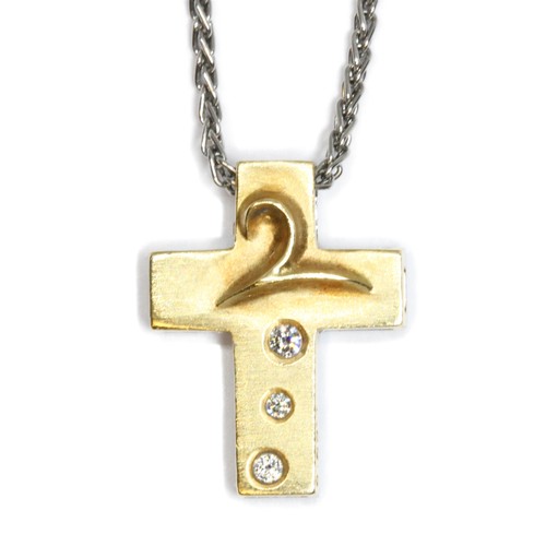 3 - BOODLES, an 18ct white and yellow gold diamond Millennium pendant, the cross set with five bezel mou... 