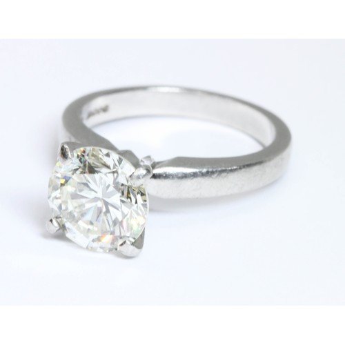 4 - A DIAMOND SOLITAIRE RING, the four claw set round brilliant cut stone weighing approximately 3cts, h... 