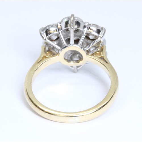 5 - A SEVEN STONE DIAMOND CLUSTER RING, the round brilliant cut stones weighing approximately 2.80cts in... 