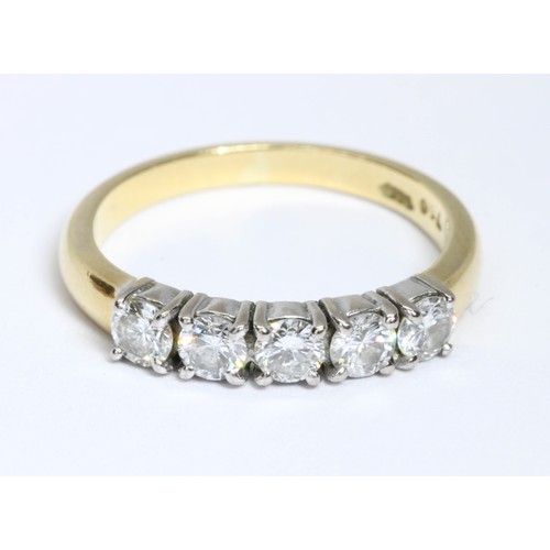 7 - A five stone diamond ring, the round brilliant cut stones weighing approximately 0.70cts in total, y... 