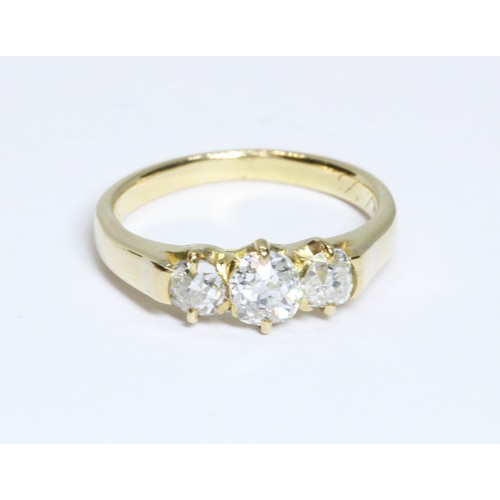 9 - An antique three stone diamond ring, the old mine cut stones weighing approximately 0.30, 0.50 and 0... 