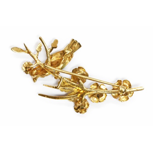 27 - A vintage cultured pearl and enamel brooch, modelled as a bird perched amongst a flowering tree, len... 