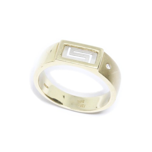 60 - A yellow metal ring with white metal Greek key design and set with a single diamond to shoulder, mar... 