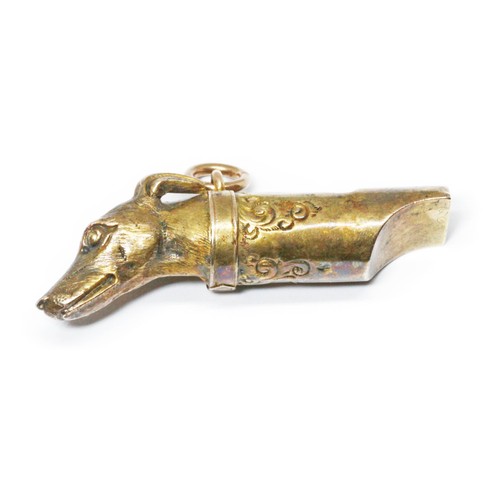 80 - A Victorian yellow metal whistle modelled as a dog's head, length 38mm, unmarked, weight 2.8g.