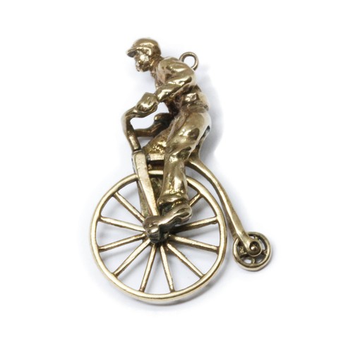 82 - A 9ct gold charm modelled as a penny farthing and rider, sponsor S&K, London 1961, length 31mm, weig... 