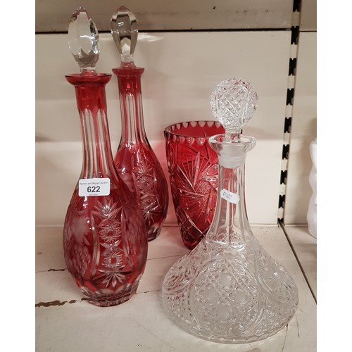 622 - Two cranberry glass decanters, another and a cranberry glass vase