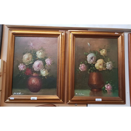 803 - Pair of 20th century school oils on canvas, still lives of flowers, 29cm x 39cm, each signed 'DIAZ' ... 